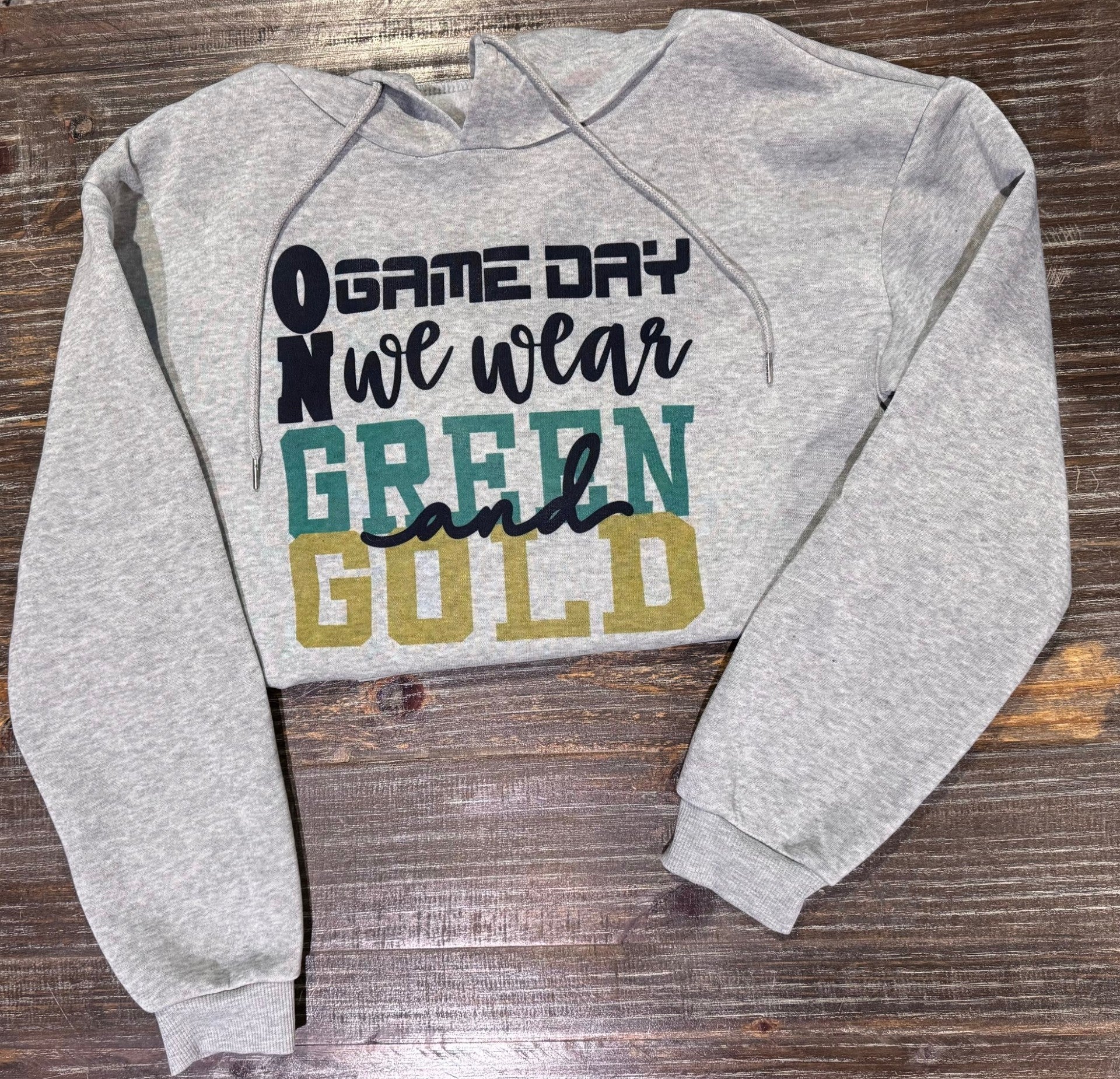 On Game Day We Wear Green and Gold